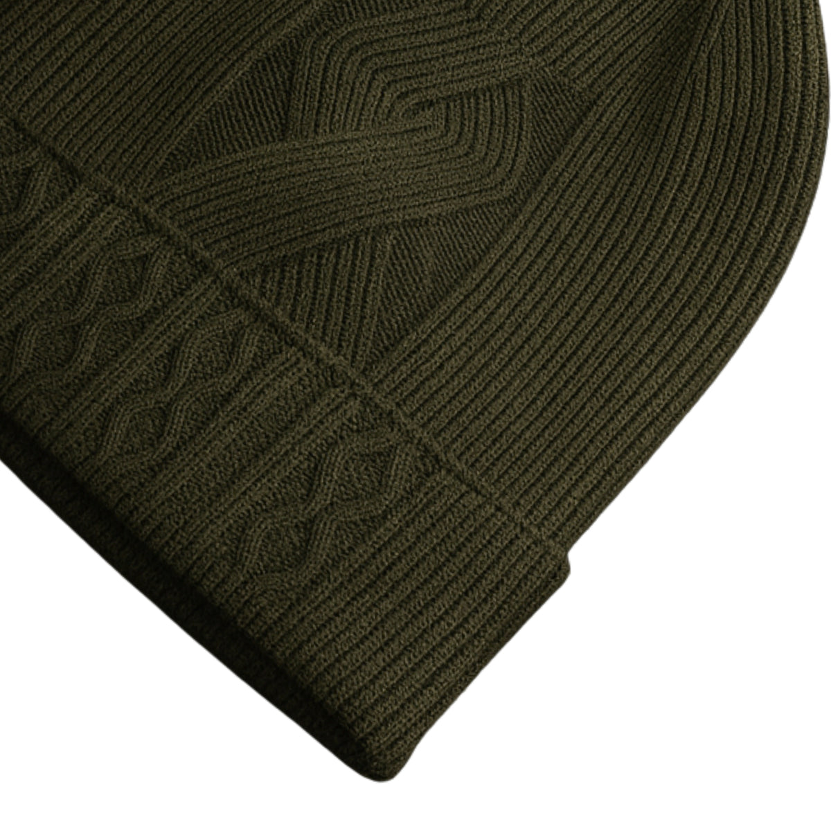 Olive knit woolen beanie with cable pattern and velvet inner photographed on a white background