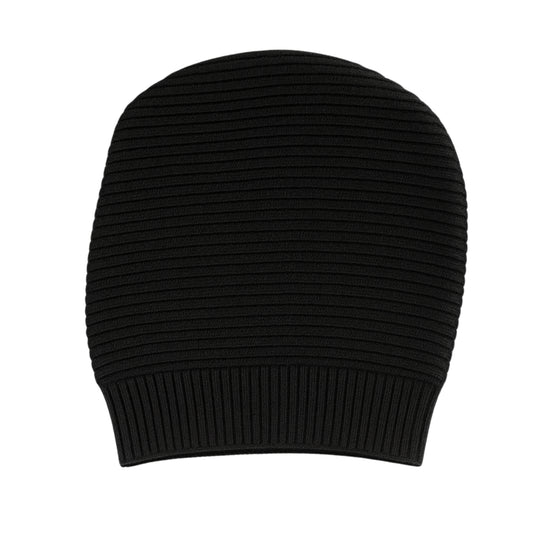 Black knitted beanie with woolen inner photographed on a white background