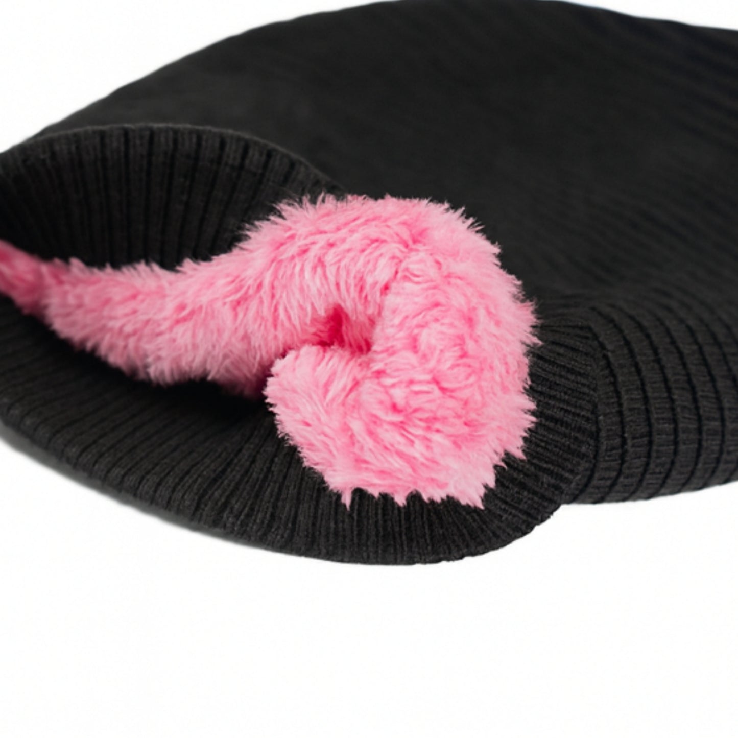 Black knitted beanie with woolen inner photographed on a white background