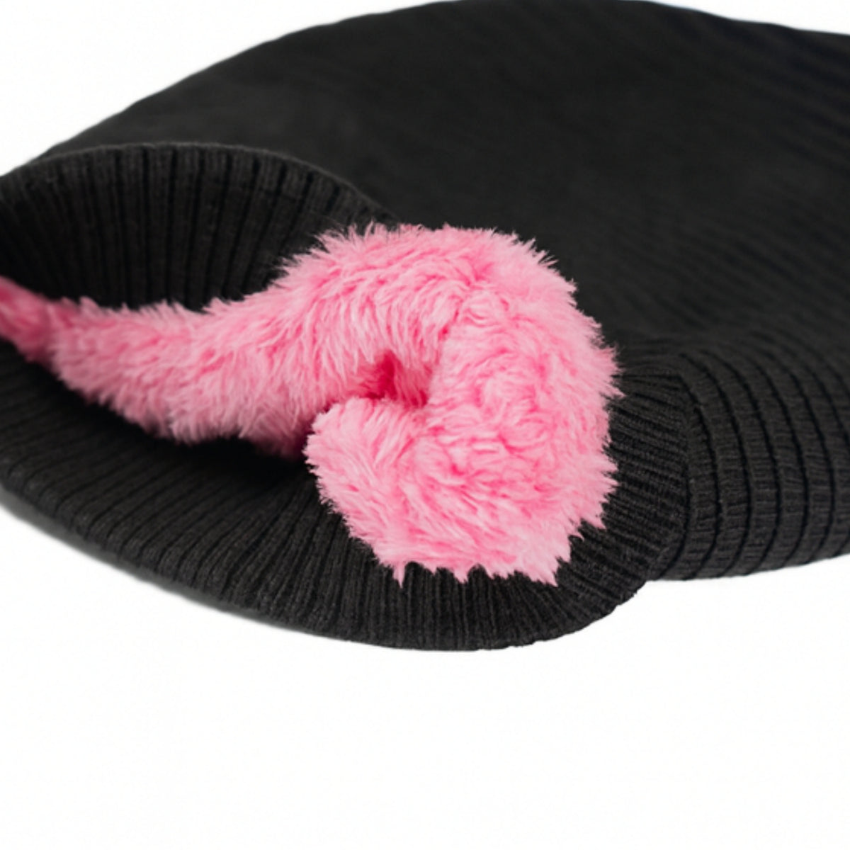 Black knitted beanie with woolen inner photographed on a white background