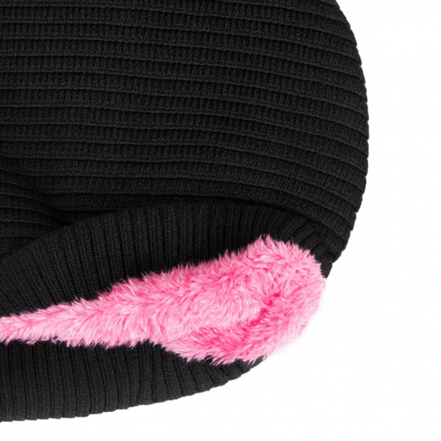 Black knitted beanie with woolen inner photographed on a white background
