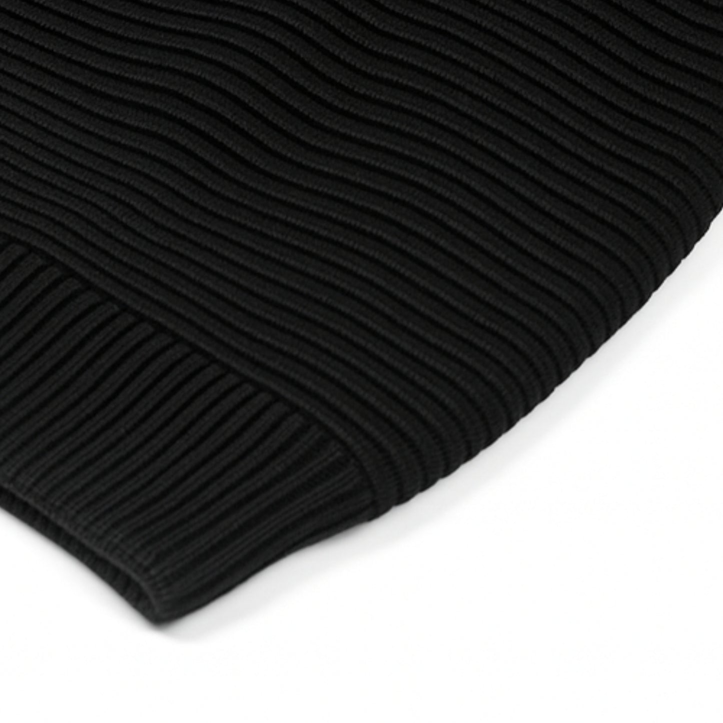Black knitted beanie with woolen inner photographed on a white background