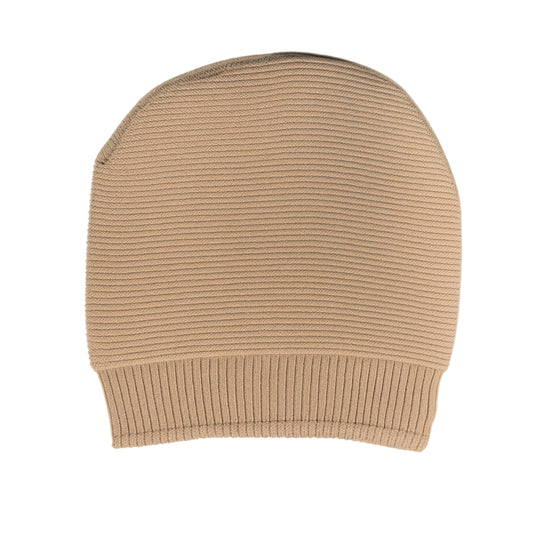 Beige knit beanie withwoolen inner photographed on a white background