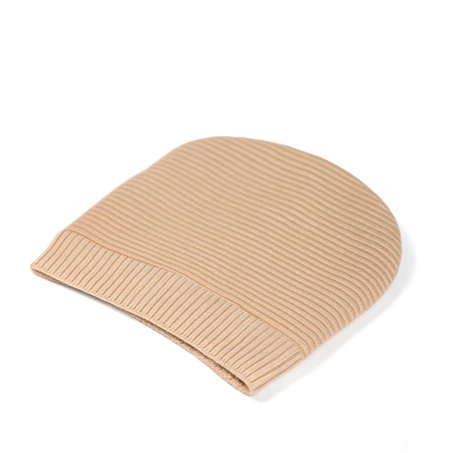 Beige knit beanie withwoolen inner photographed on a white background