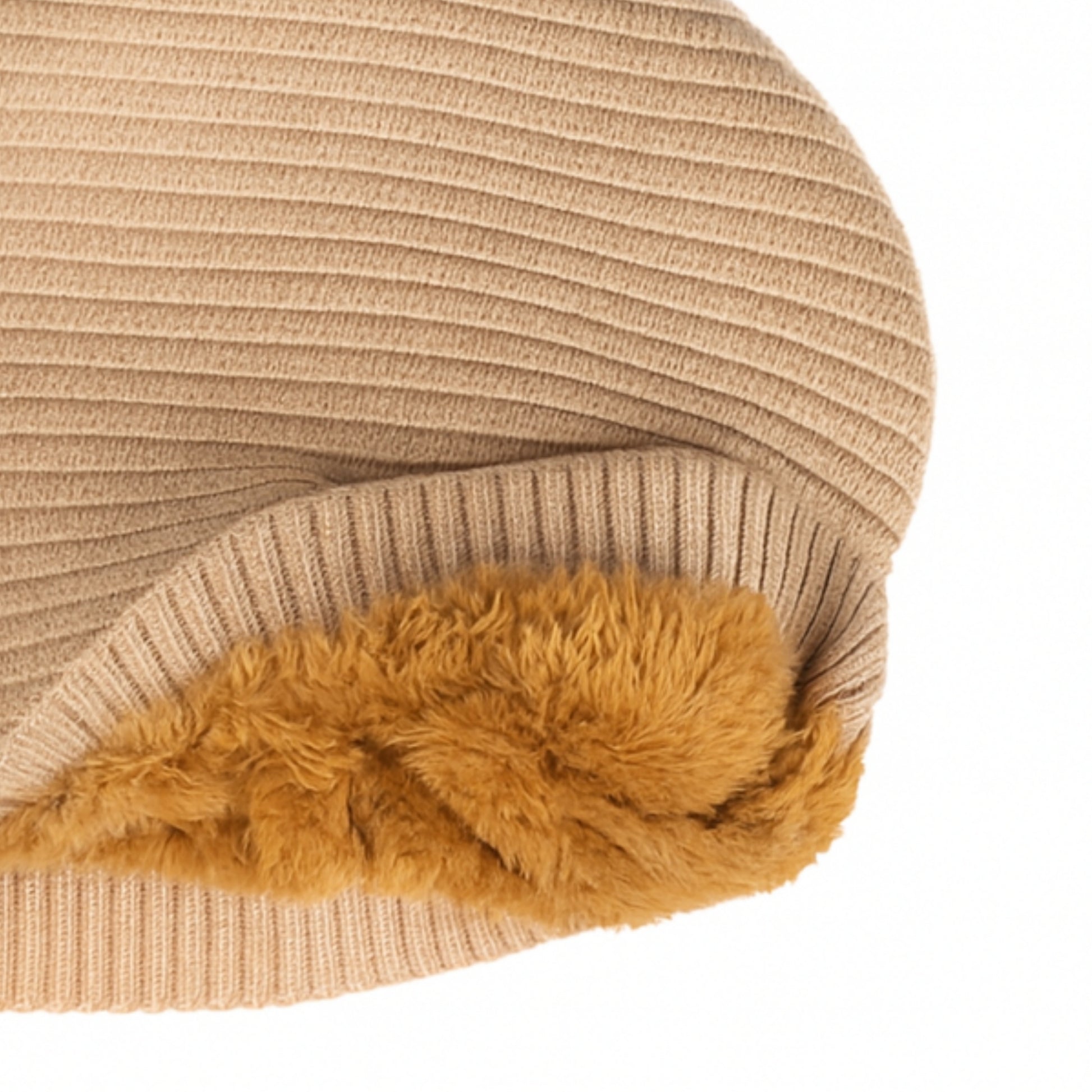 Beige knit beanie withwoolen inner photographed on a white background
