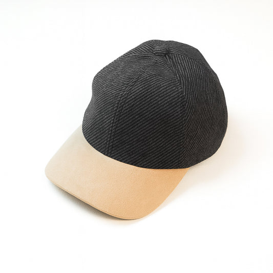 Black and beige cap on a white background