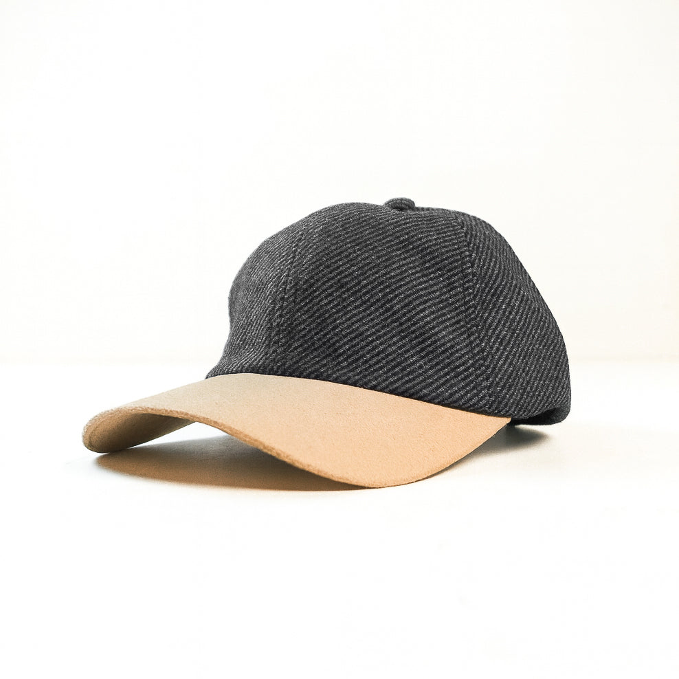 Gray cap with beige brim on a white background