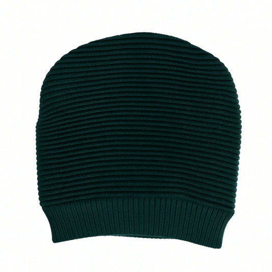 Dark green ribbed knit beanie with woolen inner photographed on a white background
