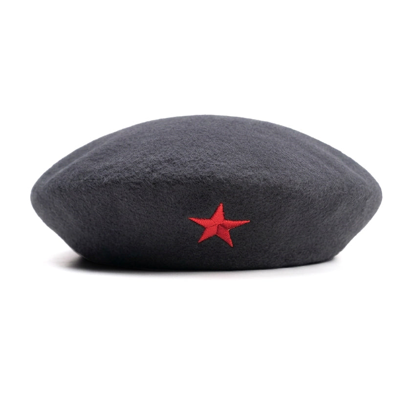 A dark gray wool hat featuring a small embroidered red five-pointed star on the front, set against a plain white background.
