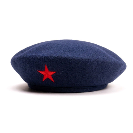 A navy blue wool beret hat featuring a red embroidered five-pointed star on the front, displayed against a clean white background.