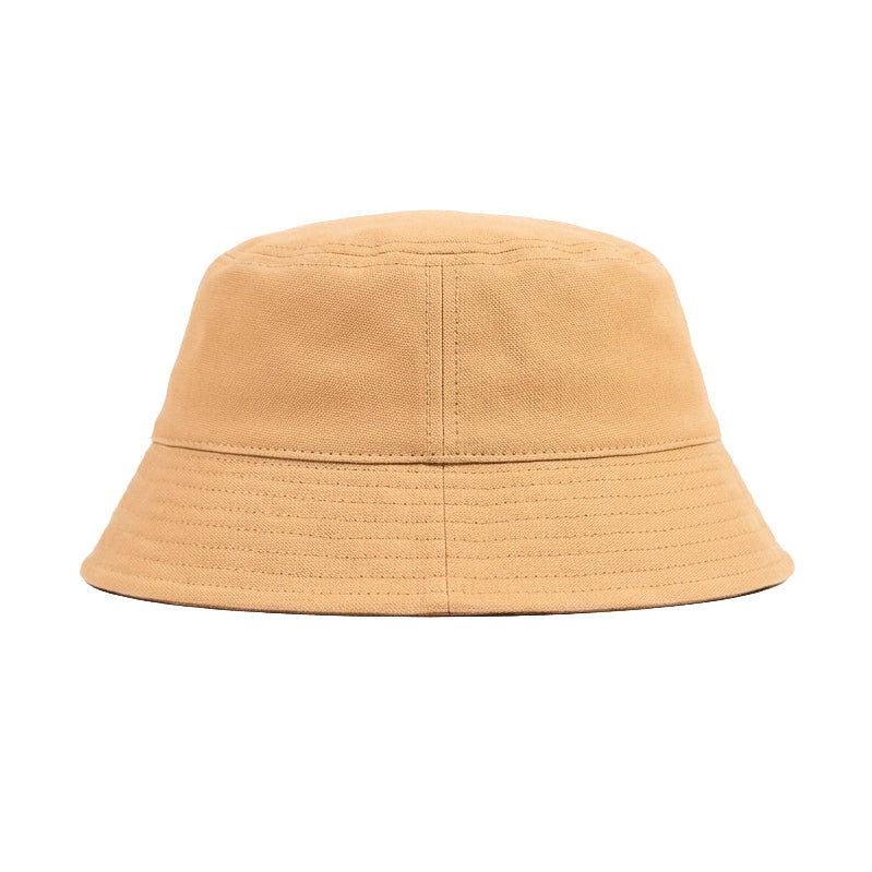 A classic bucket hat in a warm tan or camel color, photographed from the front against a solid white background.