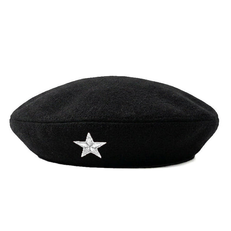 A black wool beret featuring a small, sparkling silver star embellishment on the front, set against a plain white background.