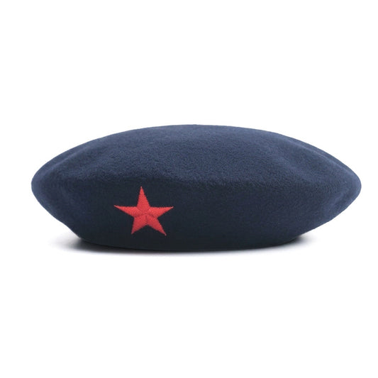 A dark navy blue hat a prominent red embroidered five-pointed star on the front, set against a plain white background.