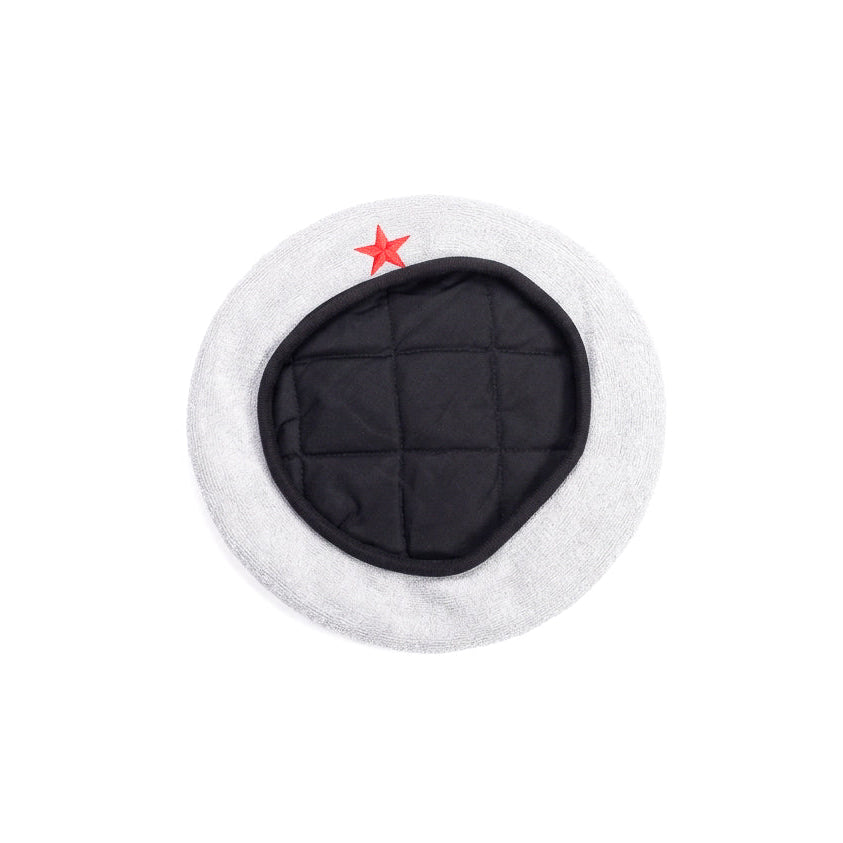A white wool military-style hat with a black quilted center panel and a small red star embroidered on the front, shown against a plain white background.