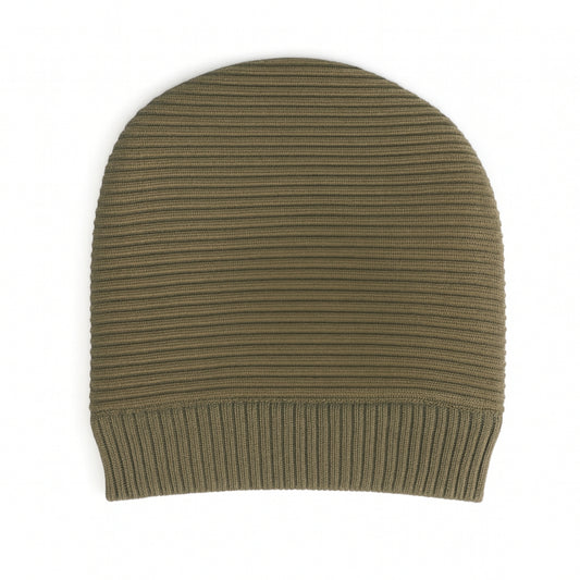 Green knit beanie with woolen inner phtographed on a white background