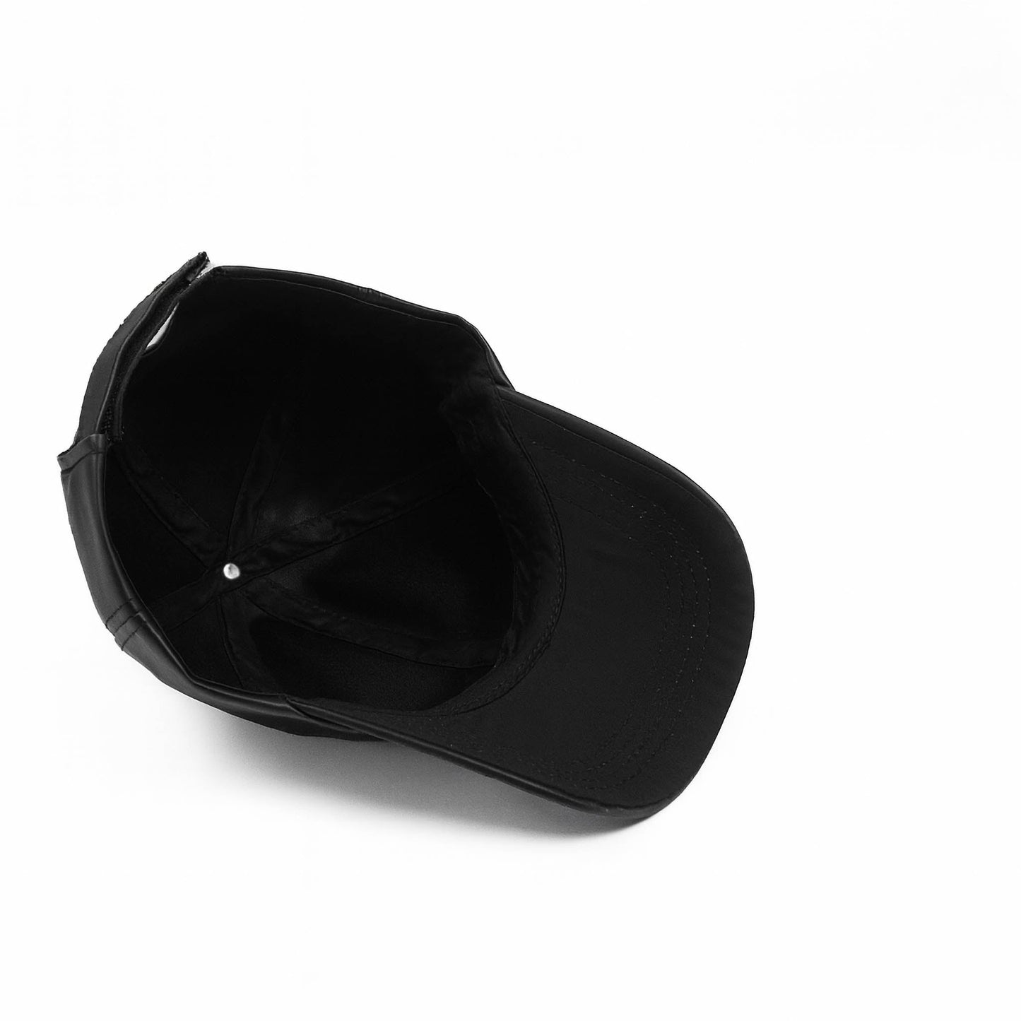 Black faux leather baseball cap with a structured high crown , stiched curved brim and an adjustable back strap photographed on a white background.
