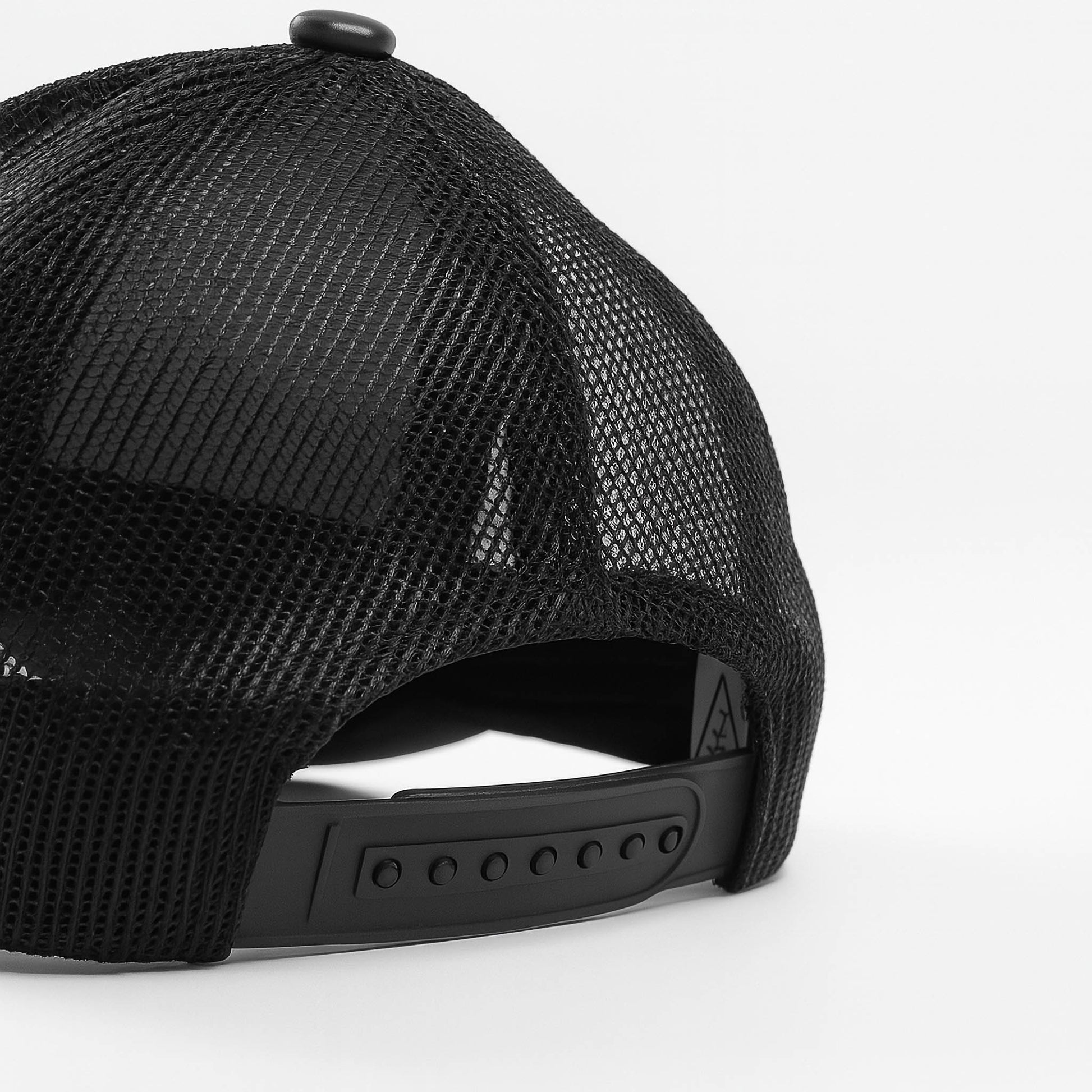 Black faux leather baseball cap with a mesh back,structured high crown , stiched curved brim and an adjustable snapback strap photographed on a white background.
