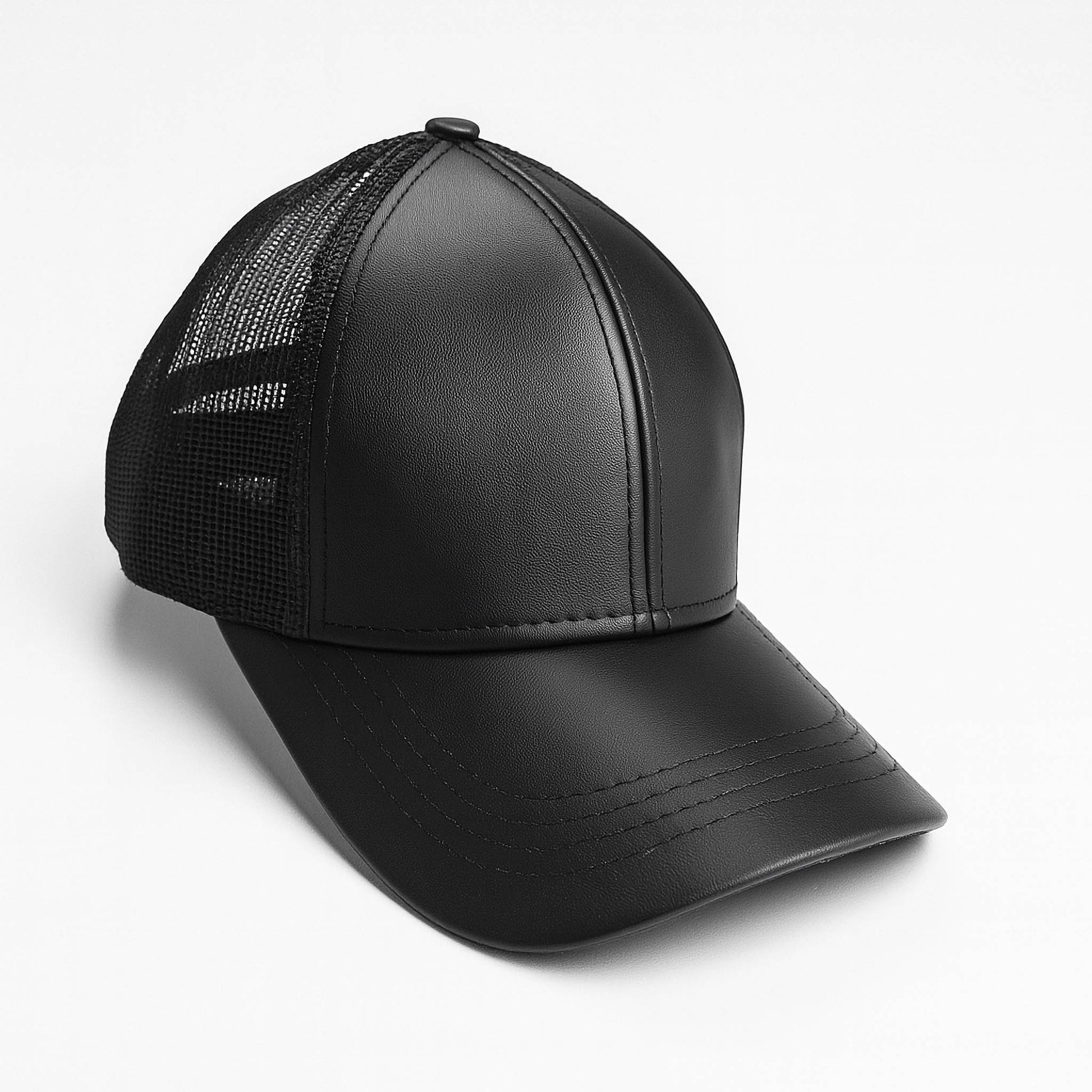 Black faux leather baseball cap with a mesh back,structured high crown , stiched curved brim and an adjustable snapback strap photographed on a white background.
