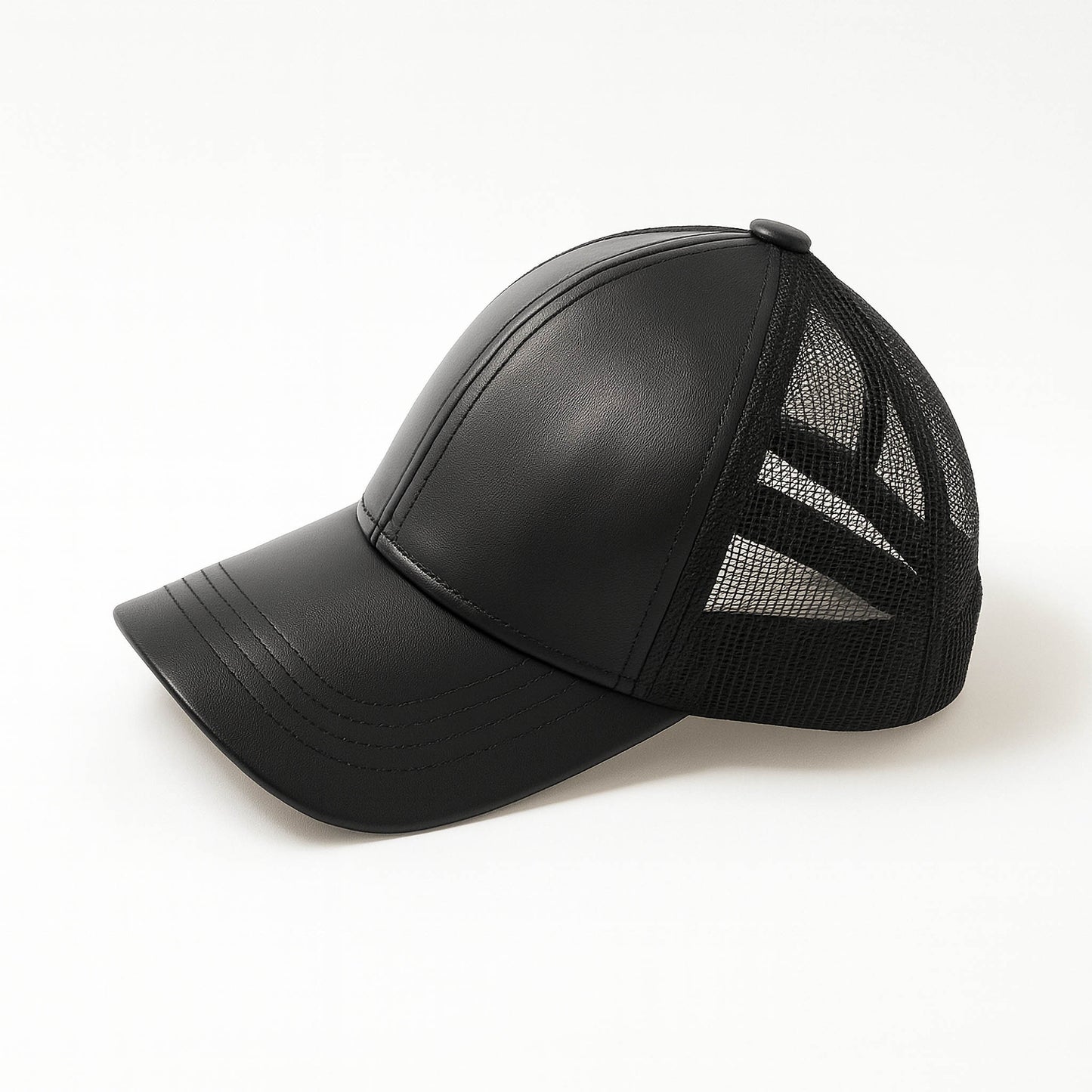 Black faux leather baseball cap with a mesh back,structured high crown , stiched curved brim and an adjustable snapback strap photographed on a white background.
