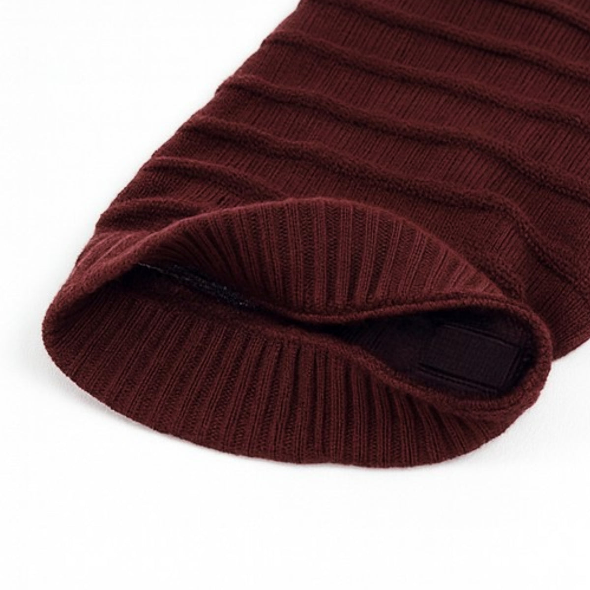 Maroon ribbed knit beanie with polyster inner photographed on a white background