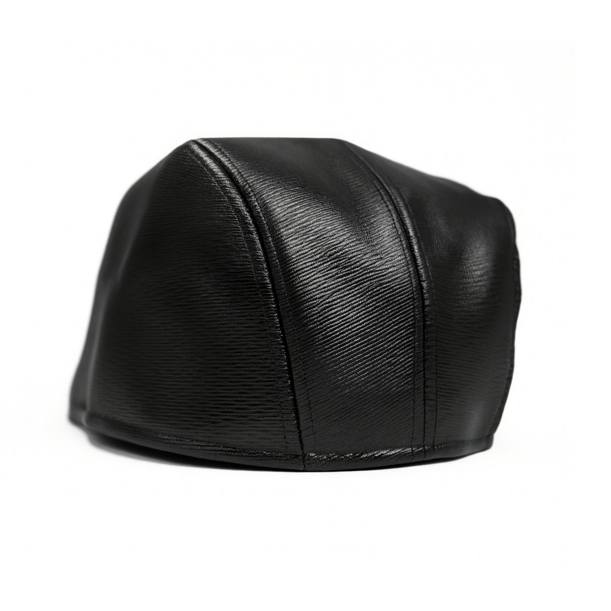 Black faux leather flat cap with a structured low crown , stiched curved in the middle and an adjustable round back photographed on a white background.

