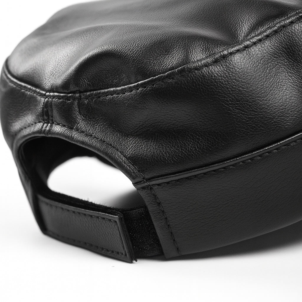 Premium black faux leather military cap by No Cap with a smooth matte finish and stitched curved brim with adjustable back strap displayed on a white background.