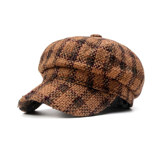 A brown and black checkered flat cap with a textured woven pattern, shown from a three-quarters angle on a white background.